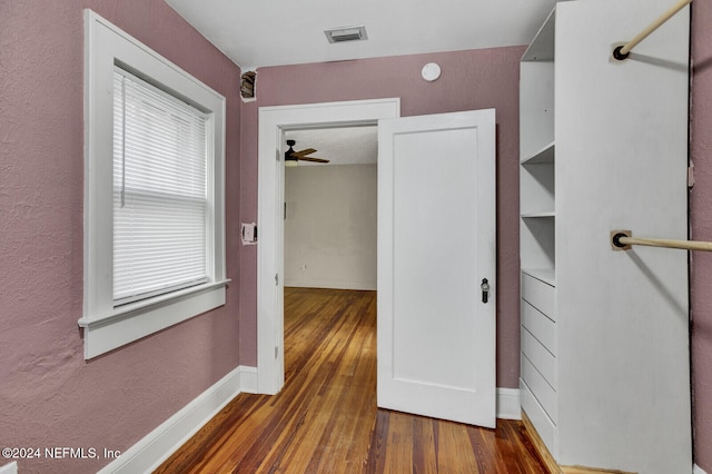 hallway featuring dark wood-type flooring