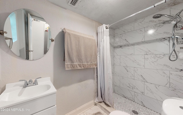 2069 W 14th St, Jacksonville, FL 32209 - full bath with marble look tile flooring, vanity, toilet, a shower stall, and baseboards