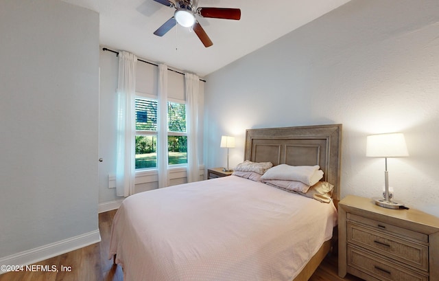 2069 W 14th St, Jacksonville, FL 32209 - bedroom featuring wood finished floors, vaulted ceiling, baseboards, and ceiling fan