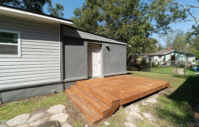 deck featuring a yard