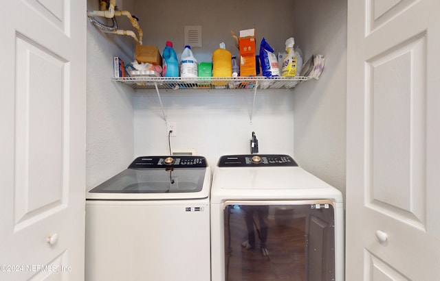 laundry area with washer and clothes dryer