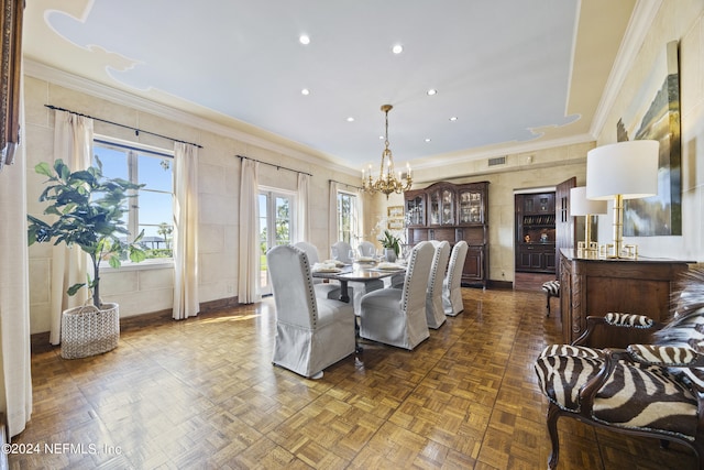 dining space with crown molding, dark parquet floors, and a chandelier