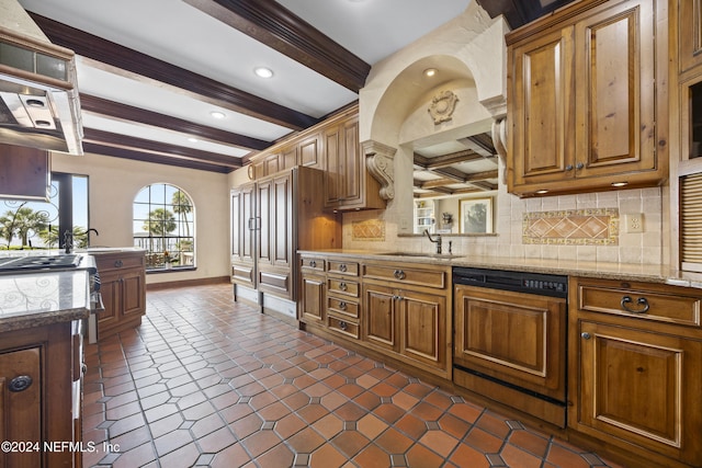 kitchen featuring dishwasher, beam ceiling, backsplash, sink, and light stone countertops