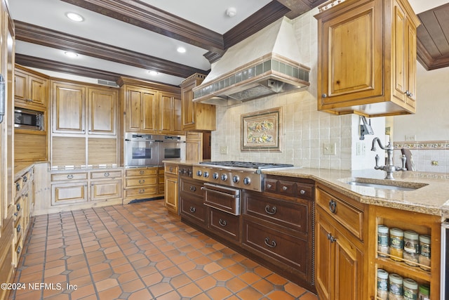 kitchen featuring custom range hood, ornamental molding, sink, appliances with stainless steel finishes, and light stone counters