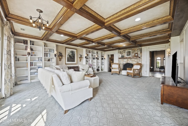 living room with light colored carpet, coffered ceiling, a fireplace, and built in shelves