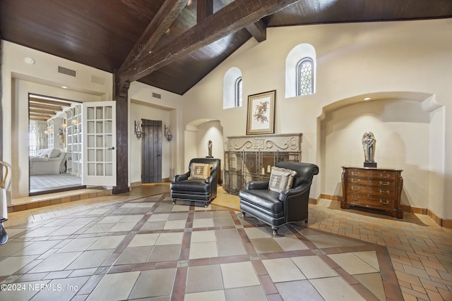 sitting room featuring tile patterned flooring, beam ceiling, high vaulted ceiling, and wood ceiling