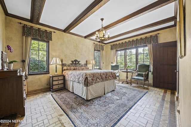 bedroom featuring ornamental molding and an inviting chandelier