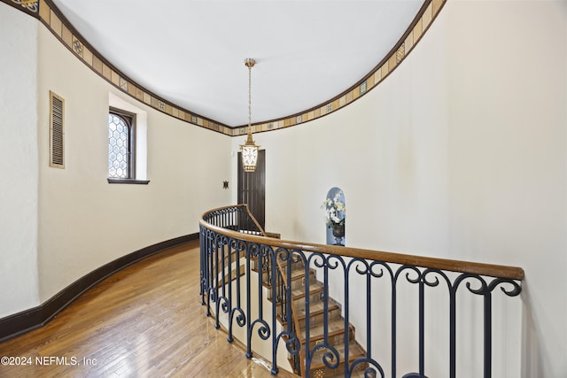 corridor with light hardwood / wood-style flooring