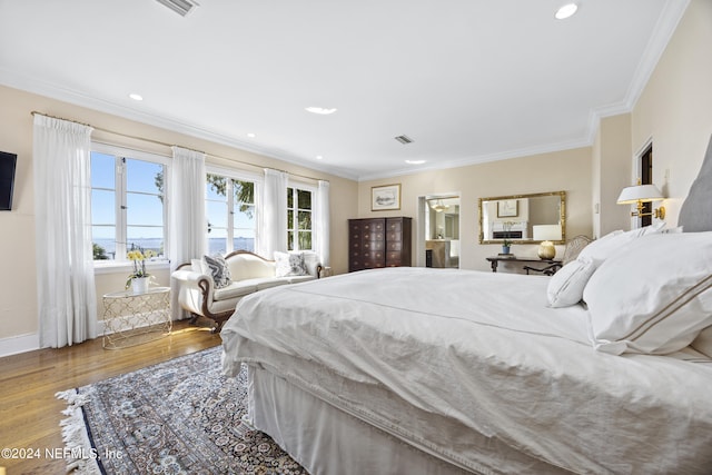 bedroom with crown molding and wood-type flooring