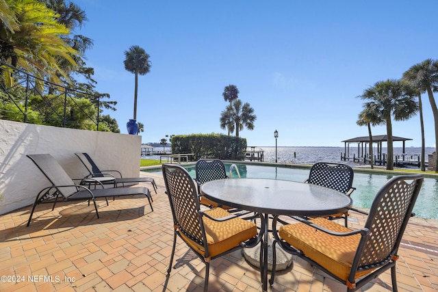 view of patio / terrace with a water view