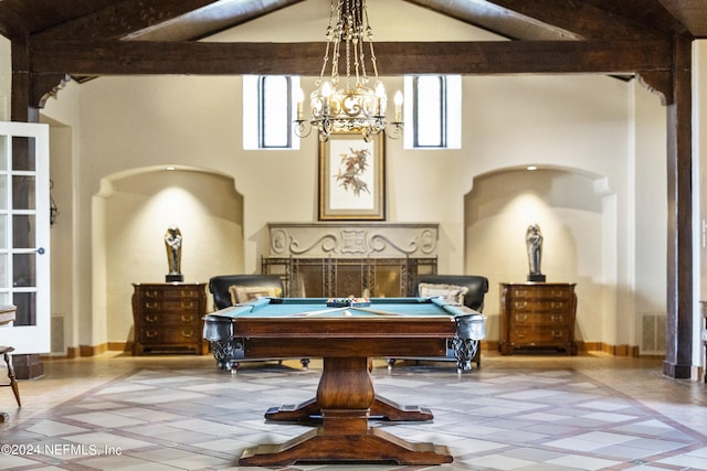 interior space with an inviting chandelier, vaulted ceiling with beams, and billiards