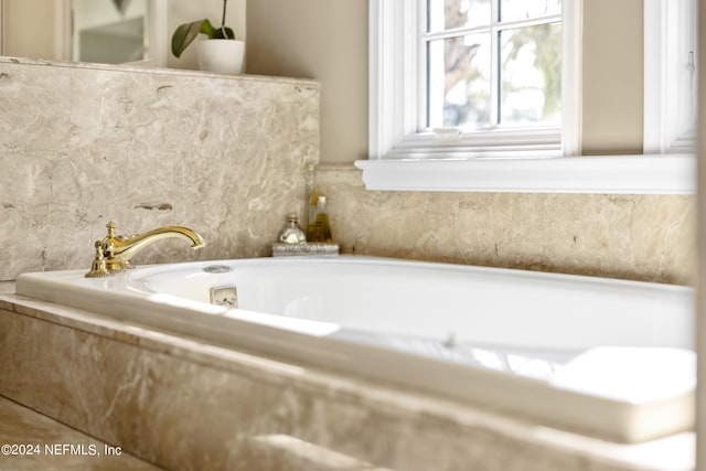 bathroom with tiled tub