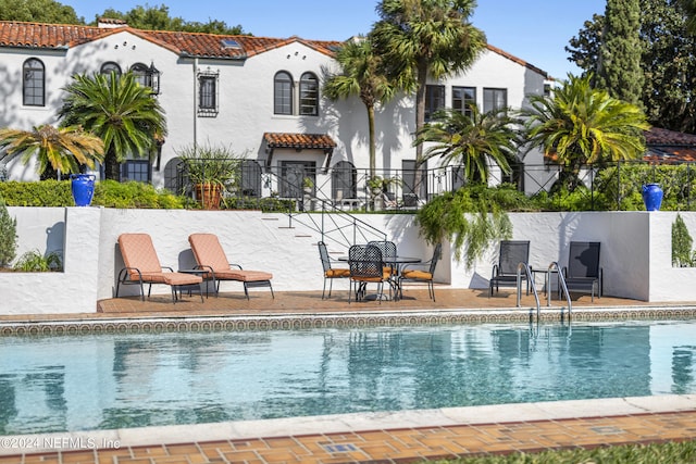 view of pool featuring a patio