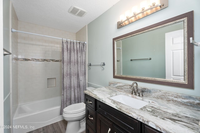 13601 Emerald Cove Ct, Jacksonville, FL 32225 - bathroom with wood finished floors, visible vents, toilet, vanity, and a textured ceiling