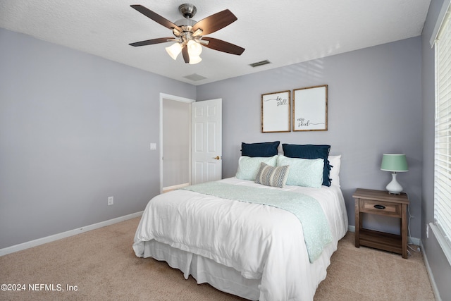 13601 Emerald Cove Ct, Jacksonville, FL 32225 - bedroom with multiple windows, ceiling fan, baseboards, and light carpet