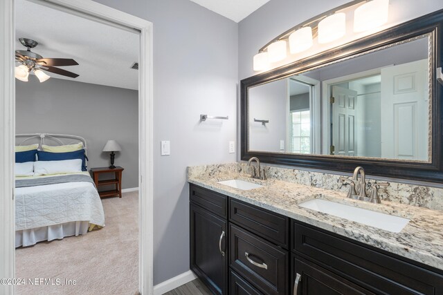 13601 Emerald Cove Ct, Jacksonville, FL 32225 - bathroom featuring a ceiling fan, ensuite bath, a sink, and double vanity