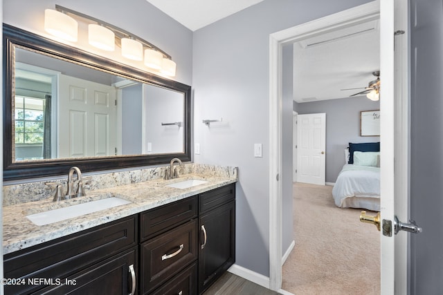 13601 Emerald Cove Ct, Jacksonville, FL 32225 - ensuite bathroom featuring baseboards, a sink, and double vanity