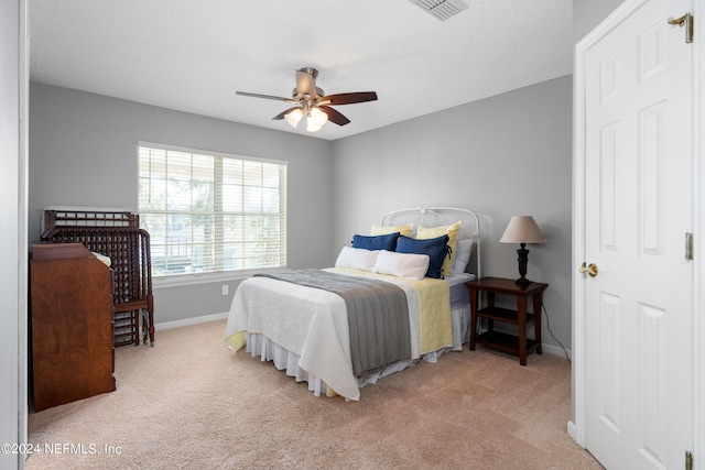 13601 Emerald Cove Ct, Jacksonville, FL 32225 - bedroom with light colored carpet, baseboards, a ceiling fan, and visible vents