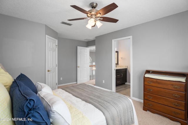 13601 Emerald Cove Ct, Jacksonville, FL 32225 - bedroom featuring baseboards, visible vents, connected bathroom, and light colored carpet
