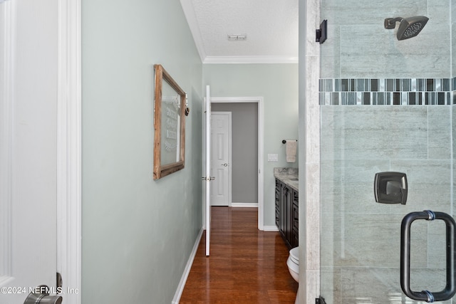 13601 Emerald Cove Ct, Jacksonville, FL 32225 - full bathroom with baseboards, wood finished floors, a shower stall, crown molding, and vanity