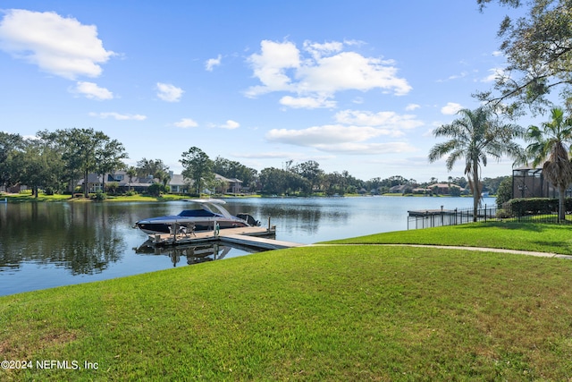 13601 Emerald Cove Ct, Jacksonville, FL 32225 - dock area with fence, a lawn, boat lift, and a water view