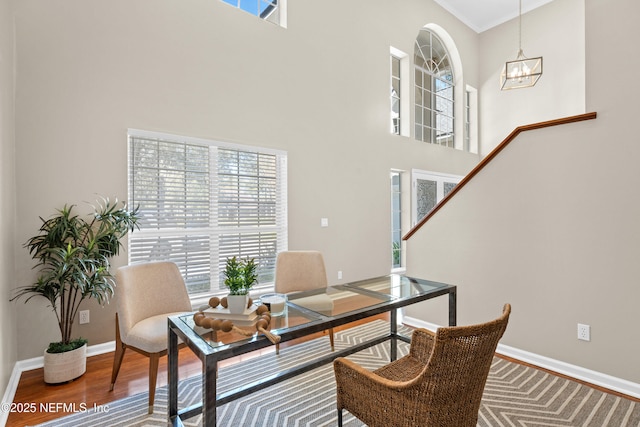 13601 Emerald Cove Ct, Jacksonville, FL 32225 - office area with baseboards, a chandelier, a high ceiling, and a wealth of natural light
