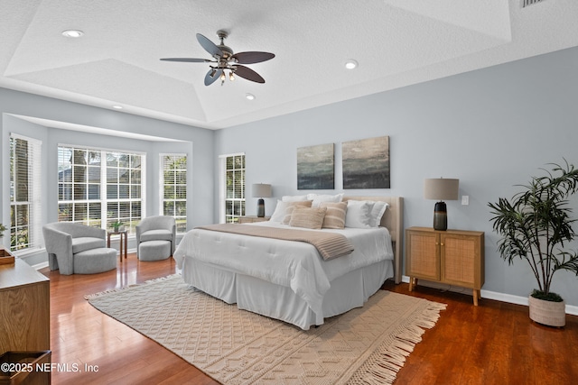 13601 Emerald Cove Ct, Jacksonville, FL 32225 - bedroom with wood finished floors, ceiling fan, a raised ceiling, baseboards, and recessed lighting