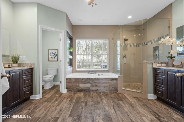 13601 Emerald Cove Ct, Jacksonville, FL 32225 - full bath featuring a shower stall, wood finished floors, toilet, vanity, and a bath