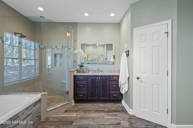 13601 Emerald Cove Ct, Jacksonville, FL 32225 - bathroom featuring a bath, a stall shower, recessed lighting, wood finished floors, and vanity
