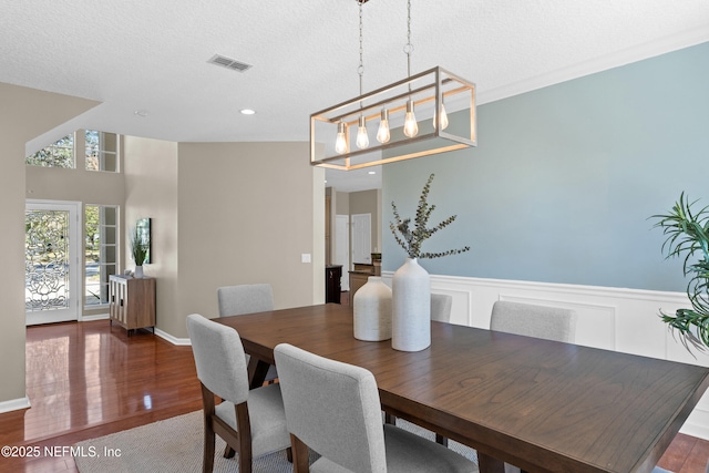 13601 Emerald Cove Ct, Jacksonville, FL 32225 - dining area with wainscoting, wood finished floors, visible vents, and recessed lighting