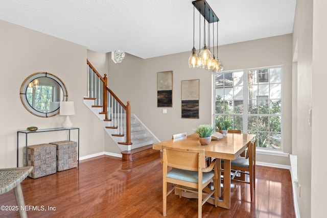 13601 Emerald Cove Ct, Jacksonville, FL 32225 - dining room featuring stairs, wood finished floors, and baseboards