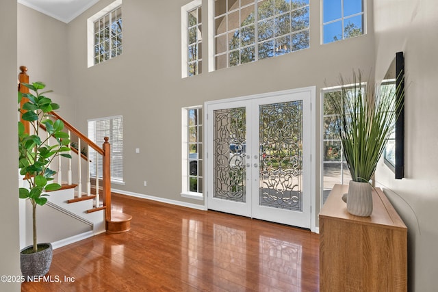 13601 Emerald Cove Ct, Jacksonville, FL 32225 - foyer with a wealth of natural light, french doors, wood finished floors, and a high ceiling