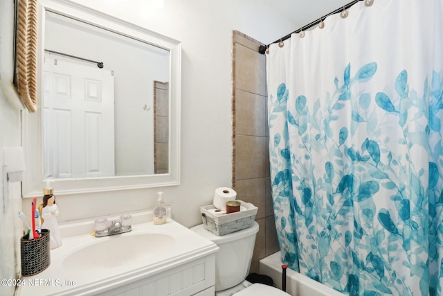 full bathroom featuring vanity, toilet, and shower / bathtub combination with curtain