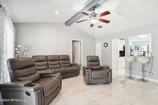 living room with ceiling fan and lofted ceiling with beams