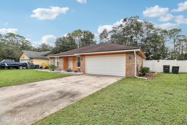 single story home with a front lawn and a garage