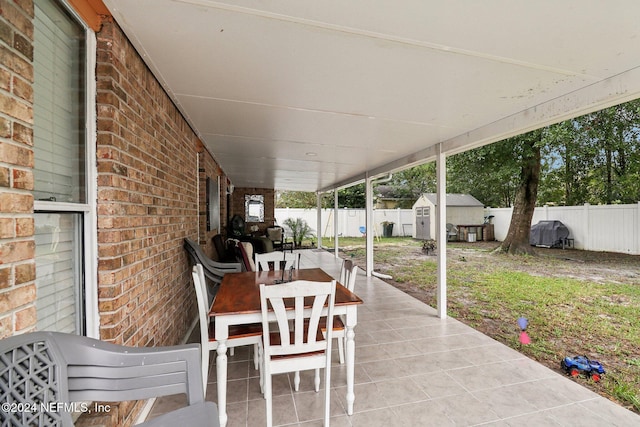 view of patio with a shed