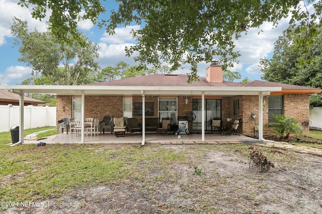 back of house featuring a patio