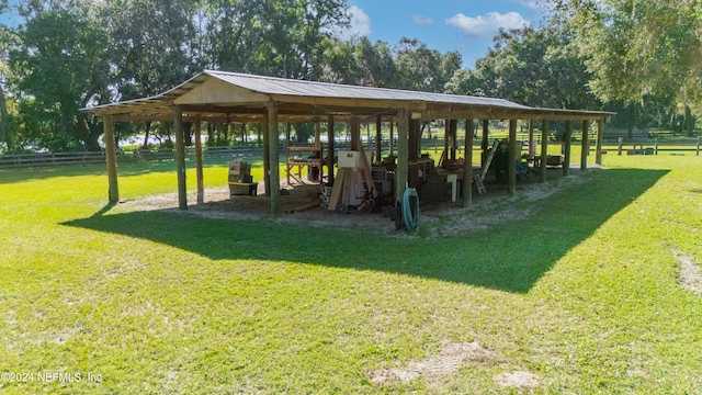 view of property's community featuring a yard