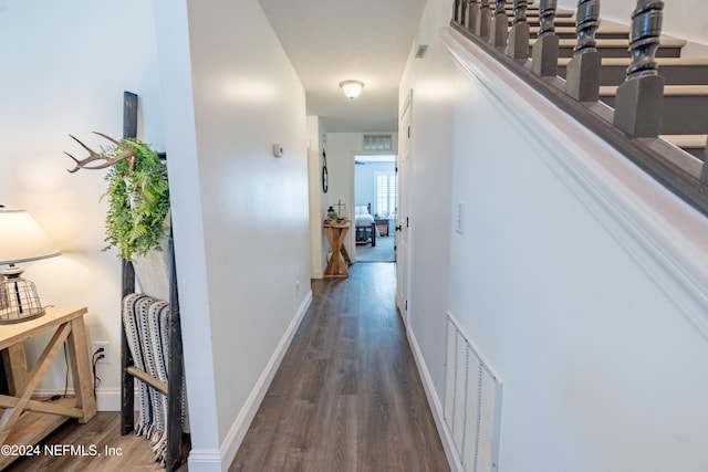 hallway with dark wood-type flooring