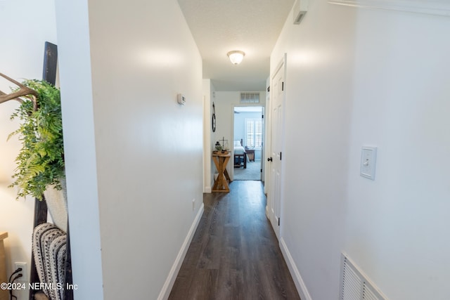 corridor featuring dark hardwood / wood-style floors