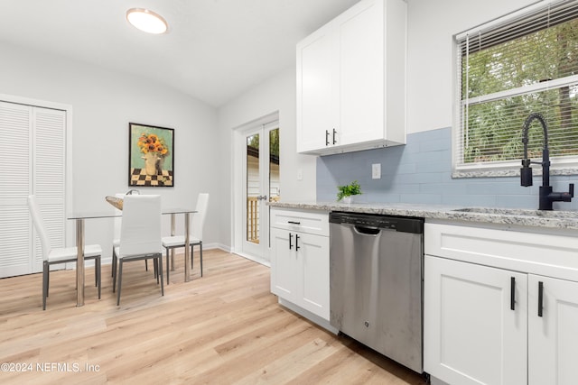 kitchen with sink, light hardwood / wood-style floors, white cabinetry, and stainless steel dishwasher