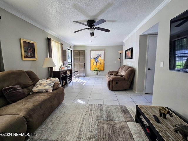 living room featuring ornamental molding, light tile patterned floors, and a textured ceiling