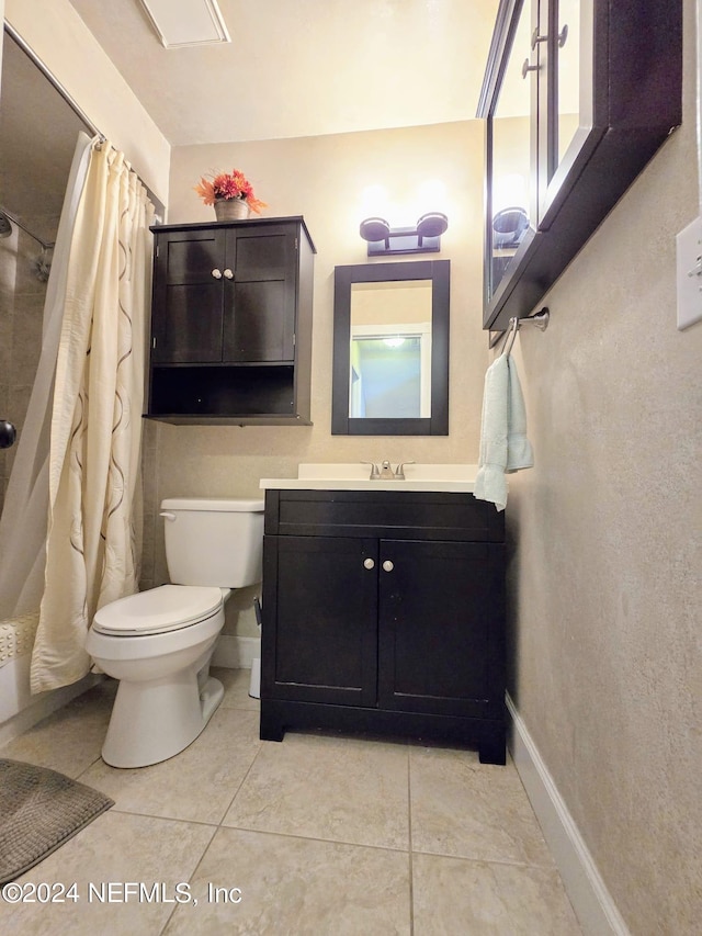 bathroom with tile patterned flooring, a shower with shower curtain, vanity, and toilet