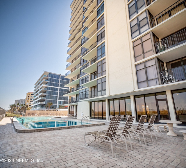 view of pool featuring a patio area