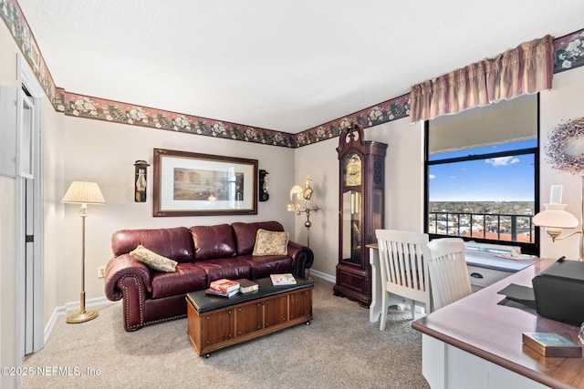1301 1st St S Unit 1202, Jacksonville Beach, FL 32250 - living area featuring light colored carpet, baseboards, and an office area