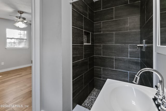 bathroom featuring vanity, hardwood / wood-style floors, and ceiling fan