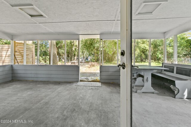 sunroom / solarium featuring plenty of natural light