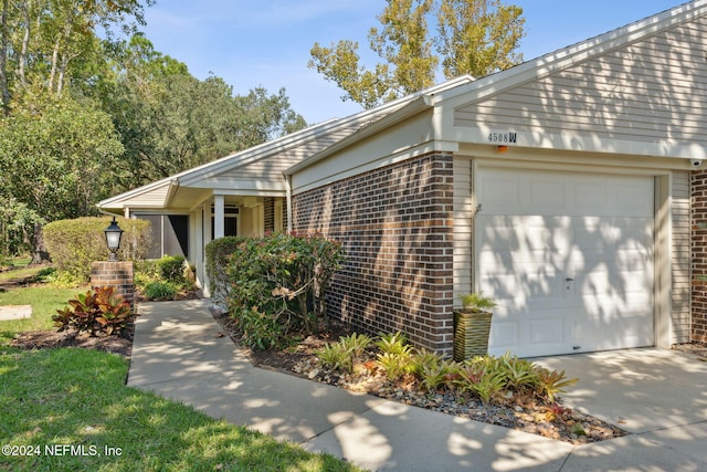 single story home with a garage