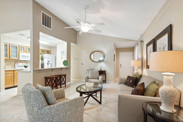 4508 Middleton Park Cir W, Jacksonville, FL 32224 - living area featuring vaulted ceiling, visible vents, ceiling fan, and light tile patterned floors