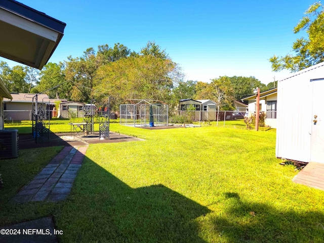 view of yard featuring a patio area and central AC